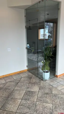 a view of an entryway door and garden