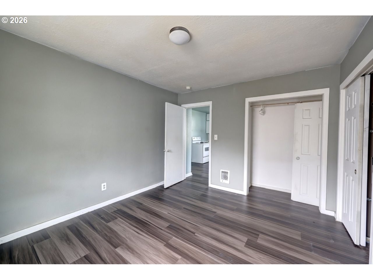 308 1st Street Garibaldi, OR 97118 - Photo 13 of 48 a view of an empty room and wooden floor