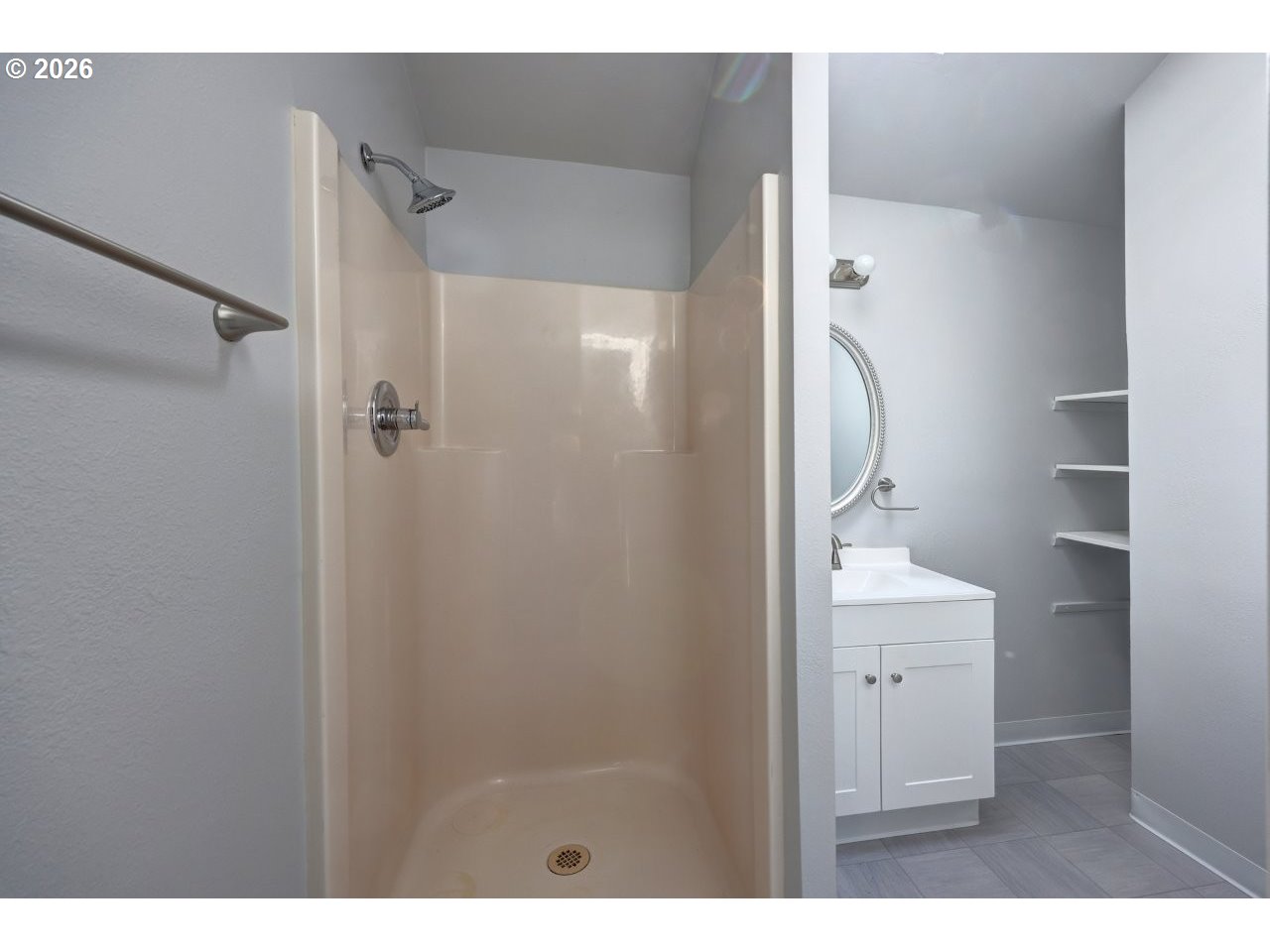 308 1st Street Garibaldi, OR 97118 - Photo 17 of 48 a bathroom with a shower and a sink
