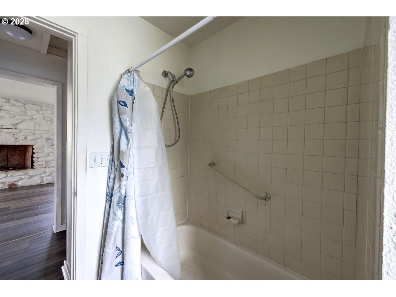 308 1st Street Garibaldi, OR 97118 - Photo 18 of 48 a bathroom with a bathtub and a shower
