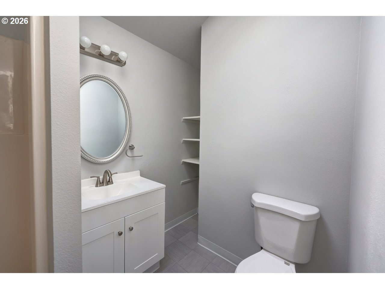 308 1st Street Garibaldi, OR 97118 - Photo 20 of 48 a bathroom with a toilet a sink and mirror