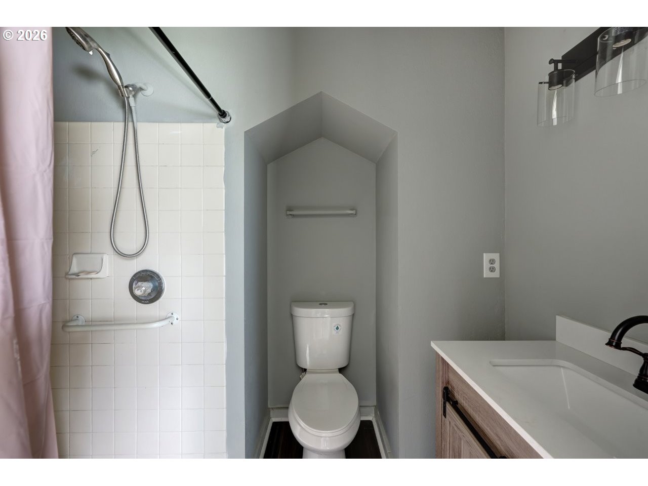 308 1st Street Garibaldi, OR 97118 - Photo 21 of 48 a bathroom with a sink toilet and shower