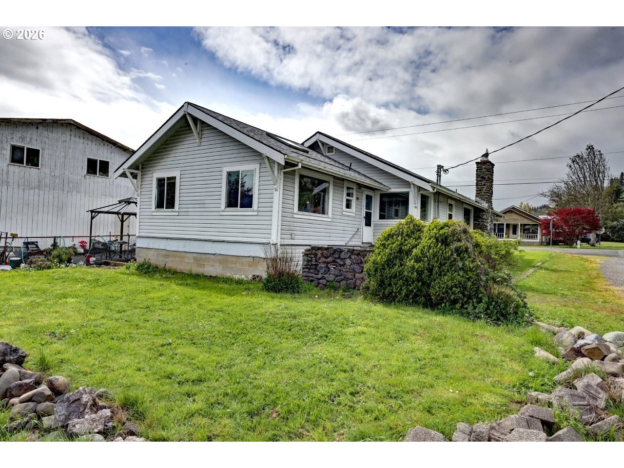 308 1st Street Garibaldi, OR 97118 - Photo 23 of 48 a house view with a garden space