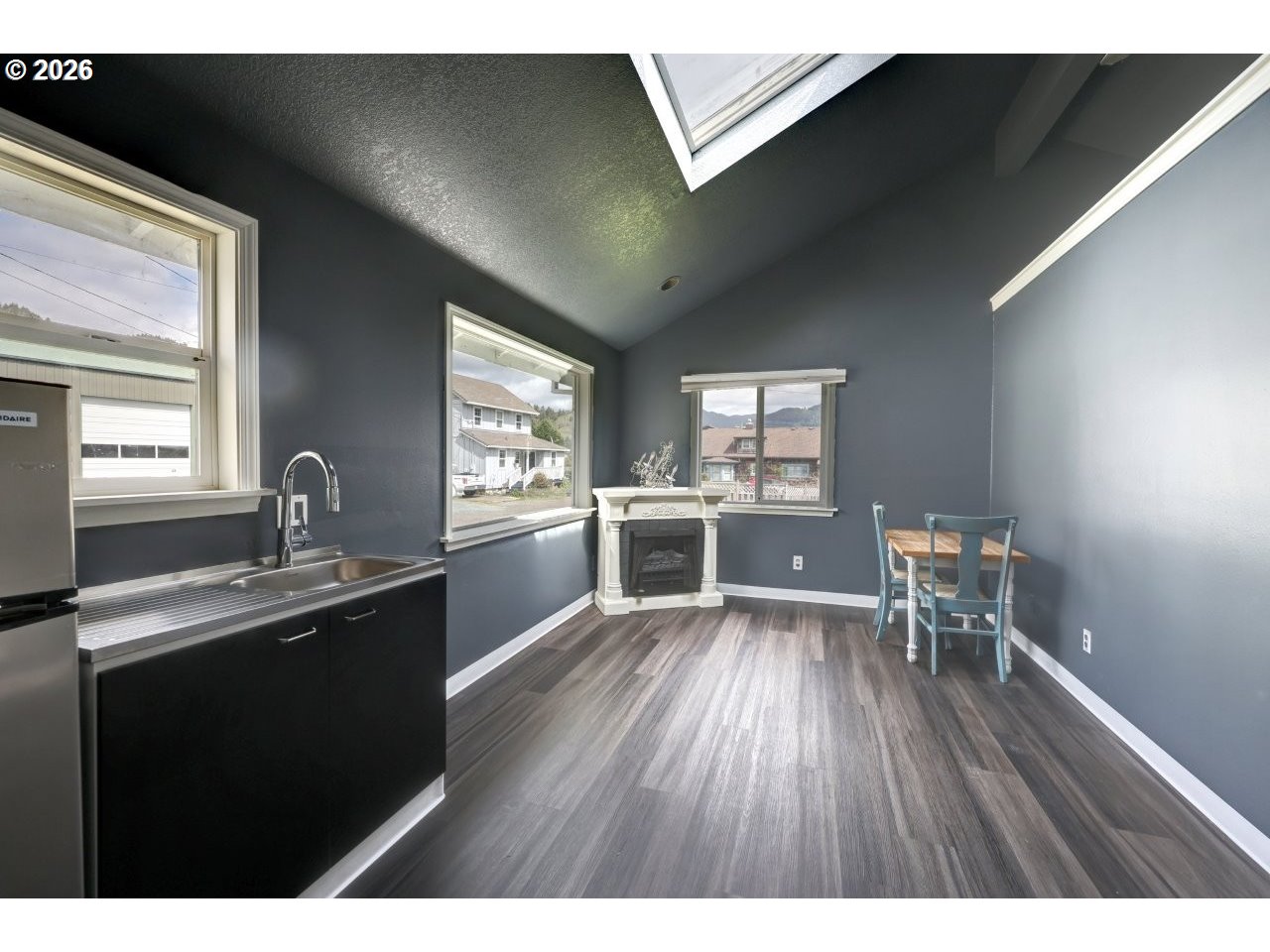 308 1st Street Garibaldi, OR 97118 - Photo 26 of 48 a kitchen with a sink and wooden floor