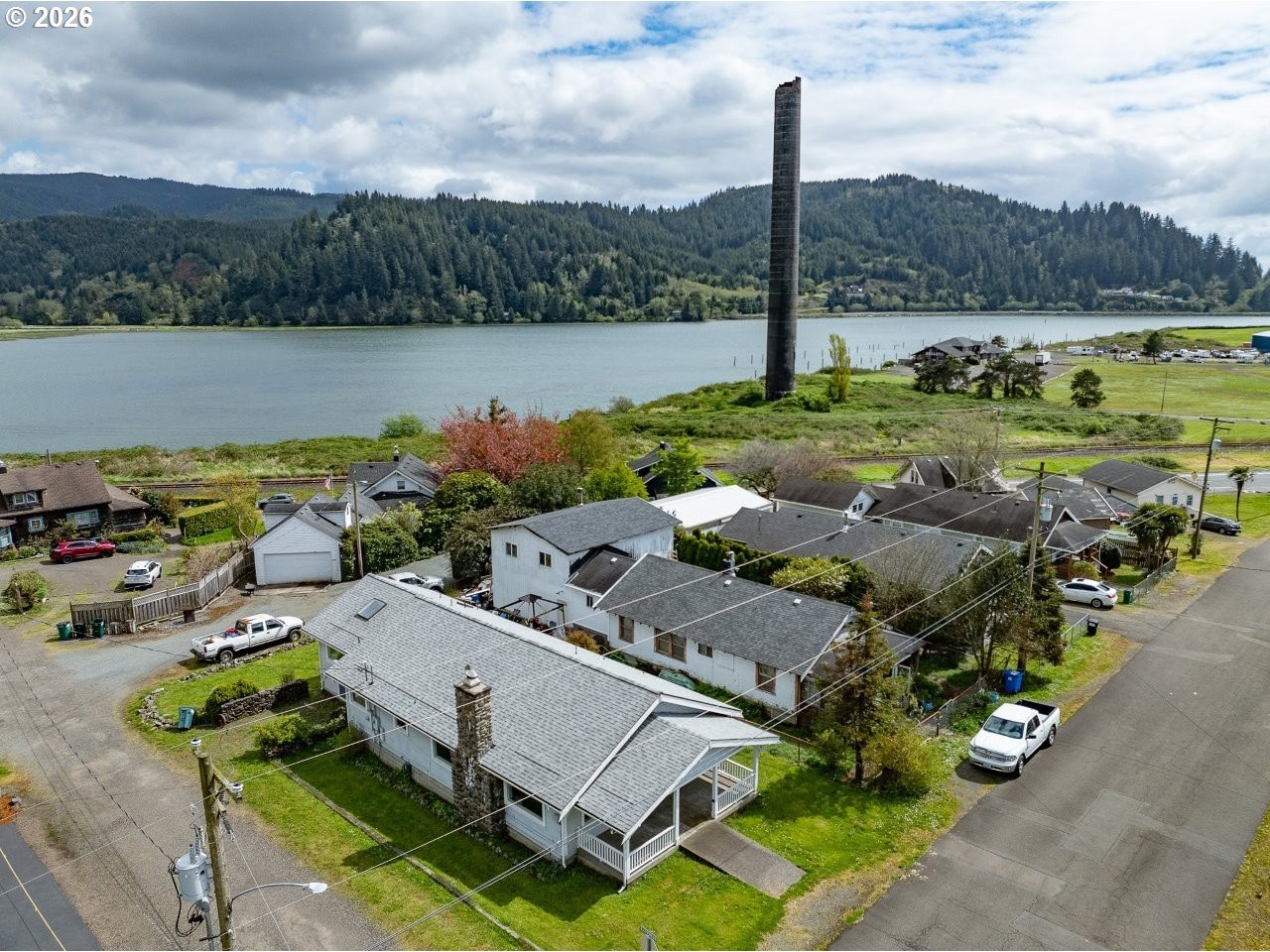 308 1st Street Garibaldi, OR 97118 - Photo 32 of 48 an aerial view of a house with garden space and lake view