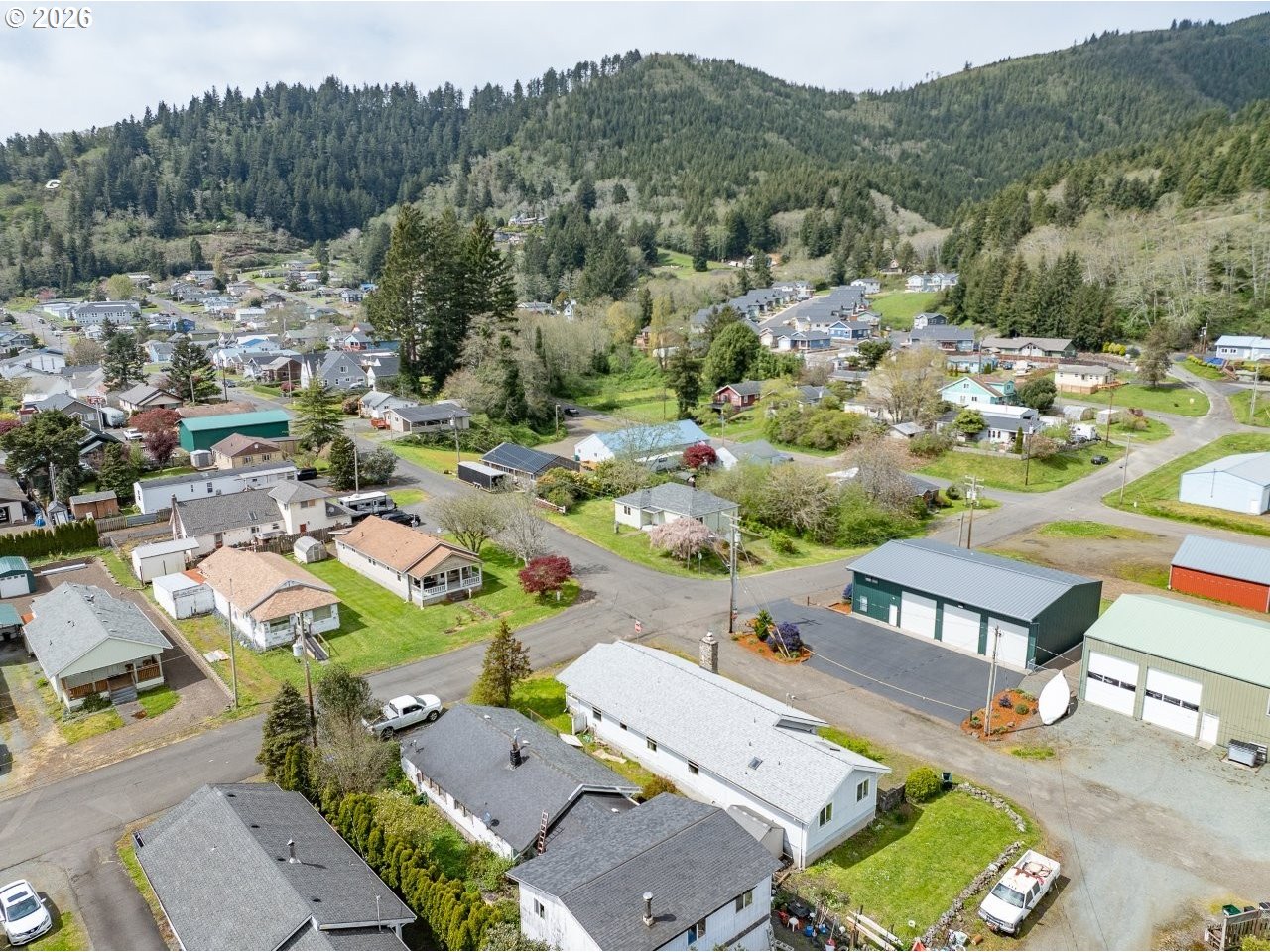 308 1st Street Garibaldi, OR 97118 - Photo 47 of 48 an aerial view of a house with a garden