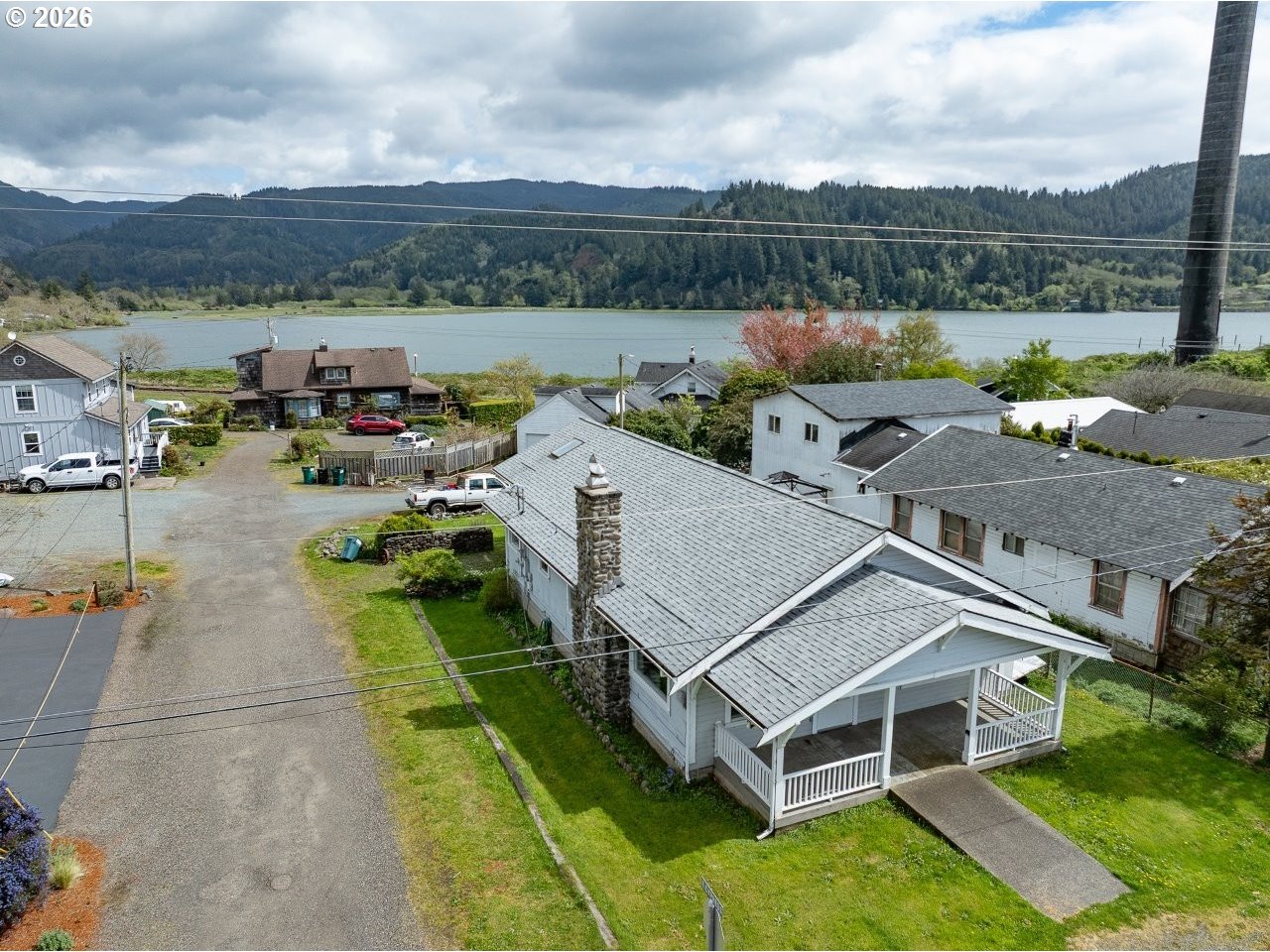 308 1st Street Garibaldi, OR 97118 - Photo 48 of 48 an aerial view of a house with pool lake view and mountain view