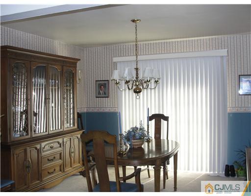 1107 New Dover Road Edison, NJ 08820 - Photo 3 of 10 a view of a dining room with furniture and window