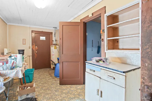 a storage room with furniture and a window