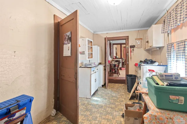 a bedroom with a bed and a table in it