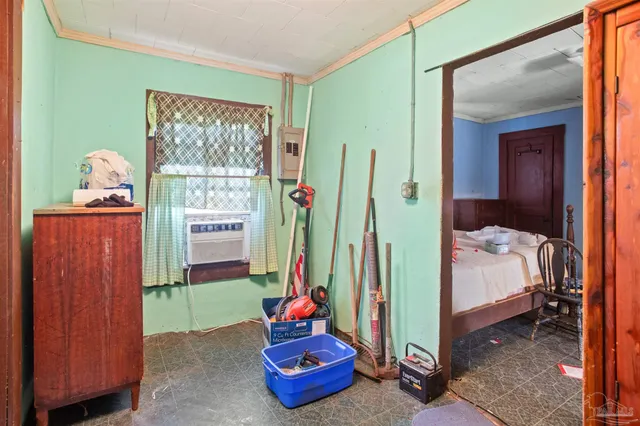 a bedroom with bed and a window