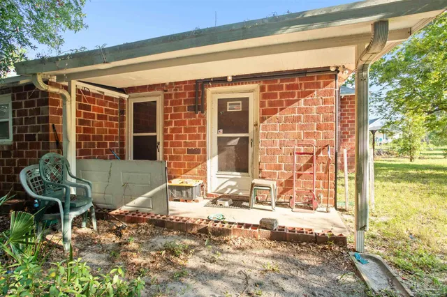 a house view with a backyard space