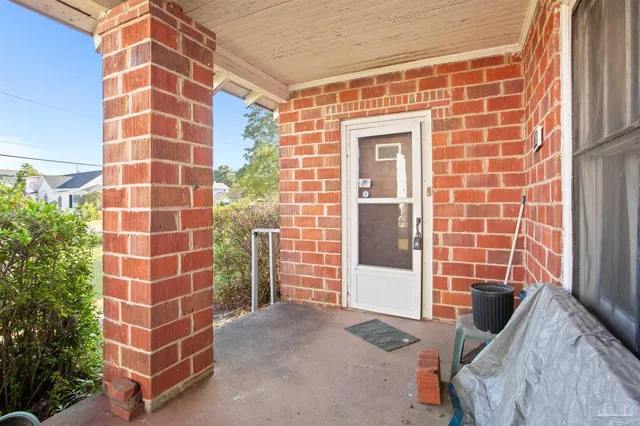 a view of a blue door and a window
