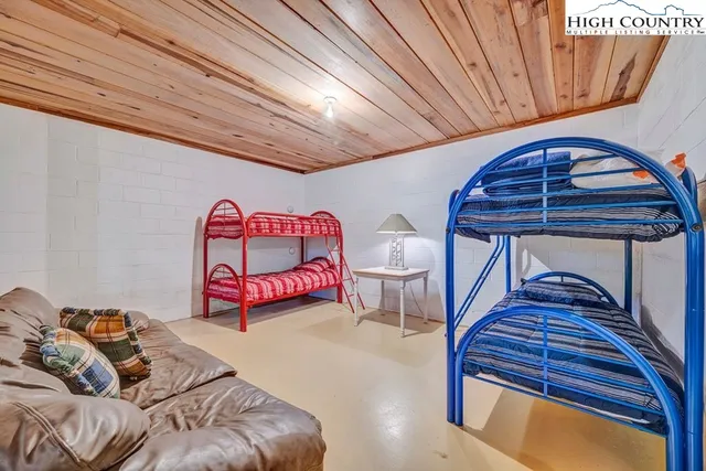 a bedroom with furniture and a bathtub