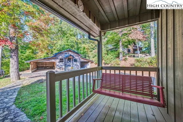 a view of a porch with wooden floor