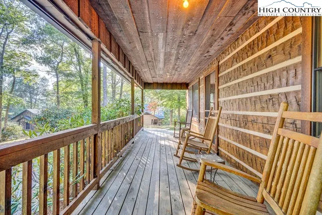 a view of balcony with couch and wooden floor