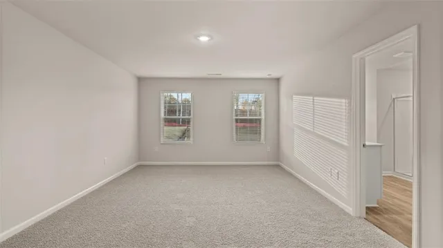 a view of empty room with windows