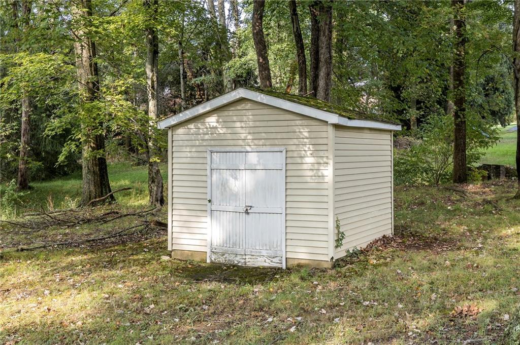 13 Spring Run Road Greensburg, PA 15601 - Photo 13 of 25 a view of a small house in the forest