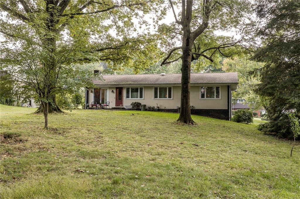 13 Spring Run Road Greensburg, PA 15601 - Photo 14 of 25 a house with tall trees in the background