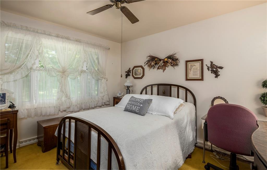 13 Spring Run Road Greensburg, PA 15601 - Photo 17 of 25 a bedroom with a bed a table and chair