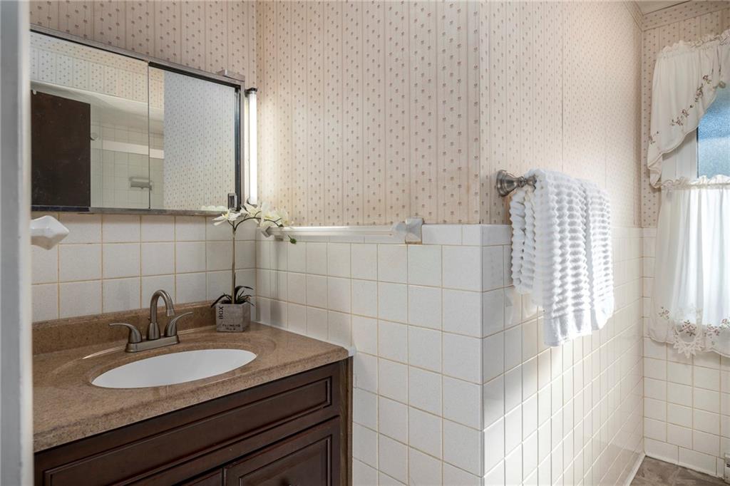 13 Spring Run Road Greensburg, PA 15601 - Photo 19 of 25 a bathroom with a granite countertop sink and a mirror