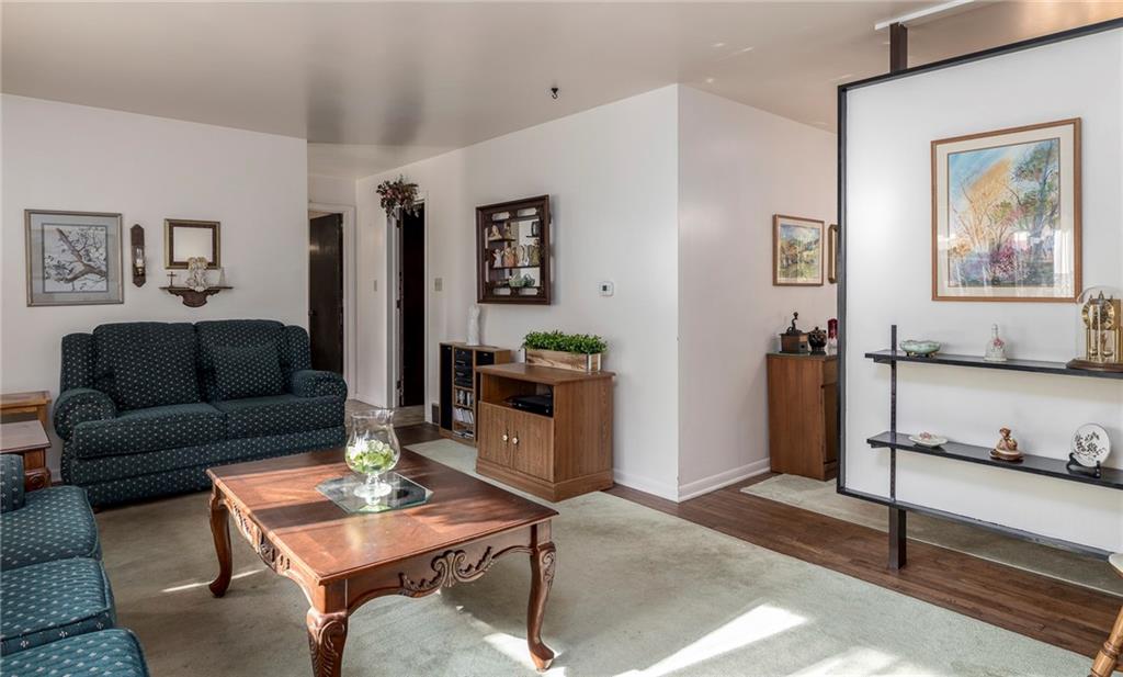 13 Spring Run Road Greensburg, PA 15601 - Photo 6 of 25 a living room with furniture a rug and a wall painting
