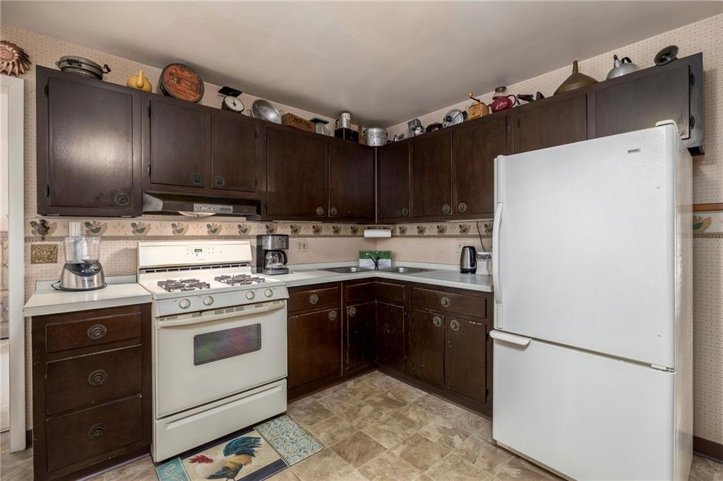 13 Spring Run Road Greensburg, PA 15601 - Photo 8 of 25 a kitchen with granite countertop a sink stainless steel appliances and cabinets