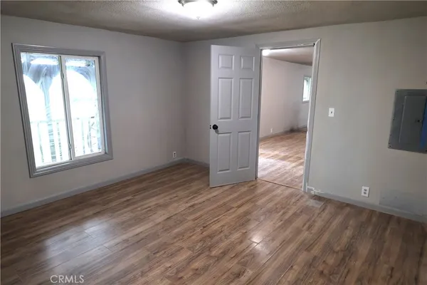 a bathroom with a granite countertop toilet and a sink