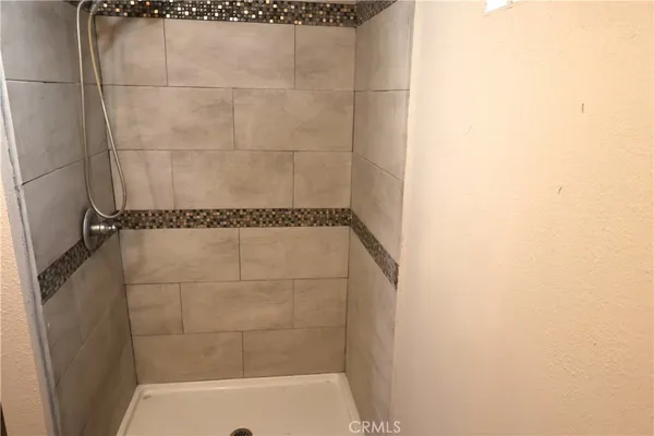 a bathroom with a toilet a sink and a window