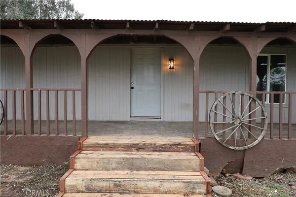 a front view of a house with stairs