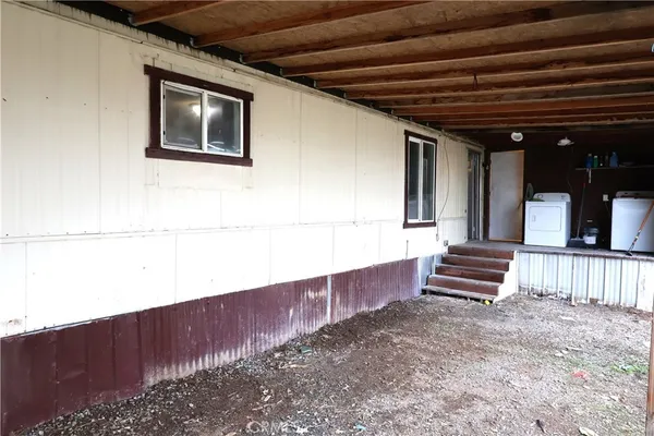 a view of a back yard of the house