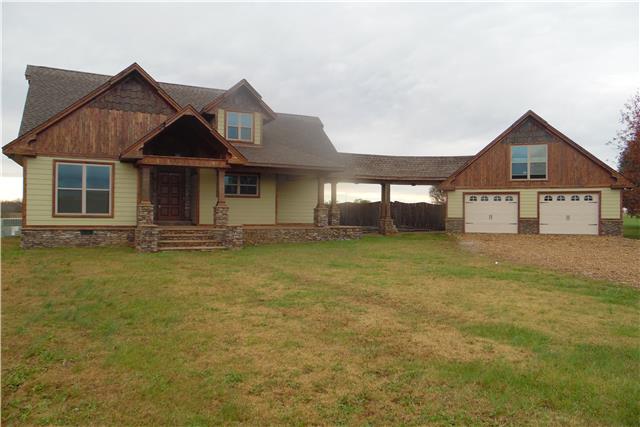 491 Rabbit Trail Road Leoma, TN 38468 - Photo 1 of 19 a front view of a house with a yard and garage