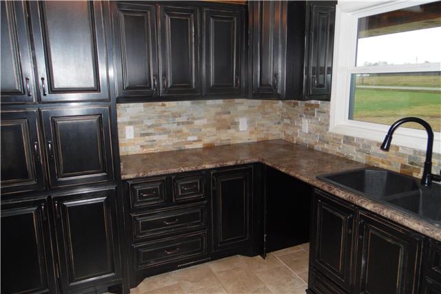 491 Rabbit Trail Road Leoma, TN 38468 - Photo 5 of 19 a kitchen with granite countertop stainless steel appliances and a sink