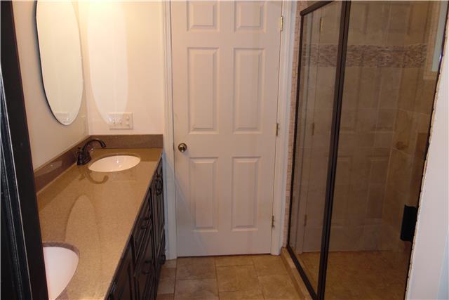 491 Rabbit Trail Road Leoma, TN 38468 - Photo 10 of 19 a bathroom with a granite countertop sink and a mirror