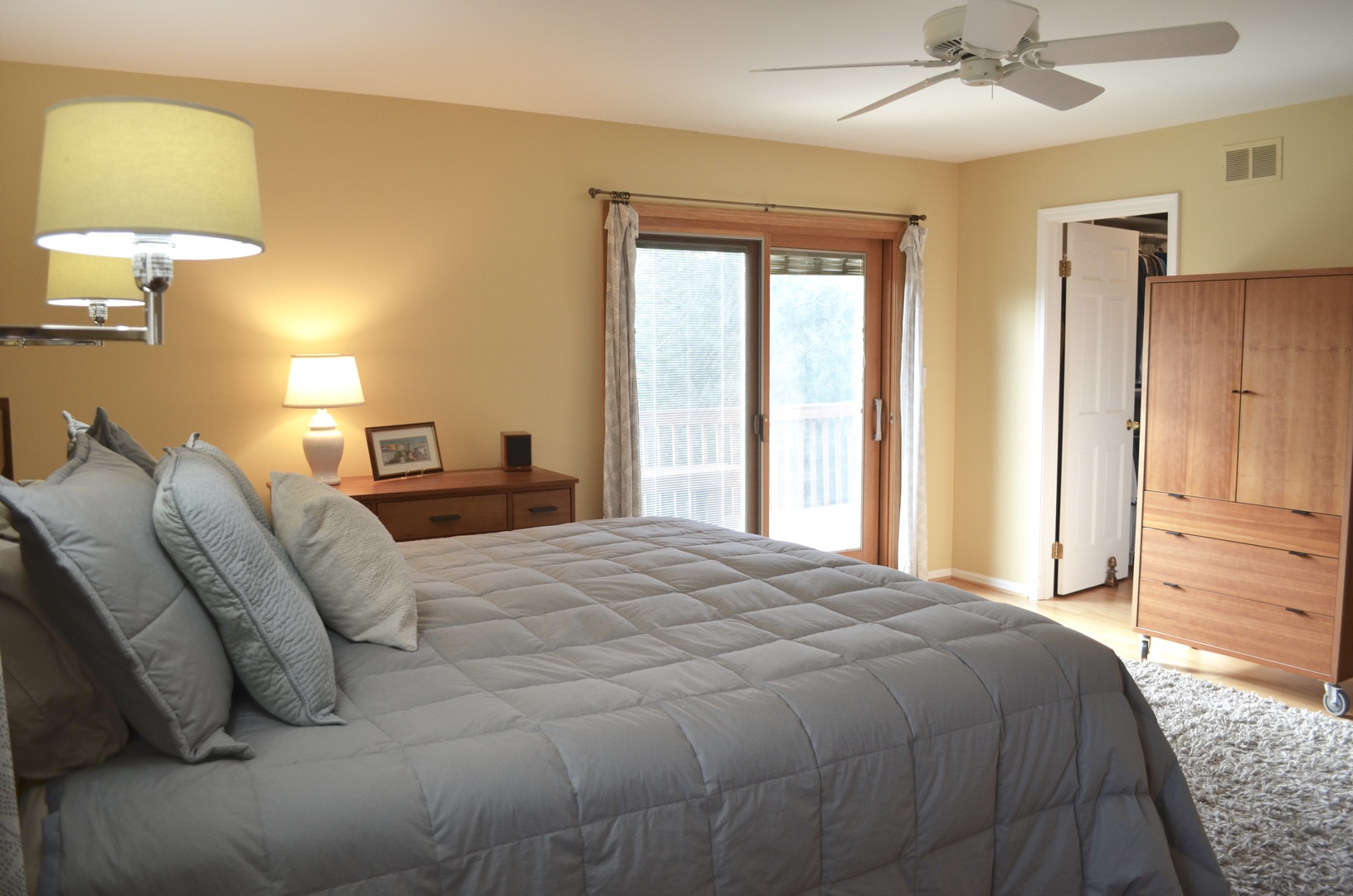 2120 Applecross Road Inverness, IL 60010 - Photo 16 of 38 a bedroom with a bed and a chandelier