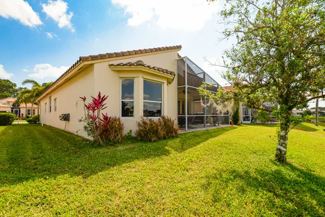 a view of a lake with houses in the back