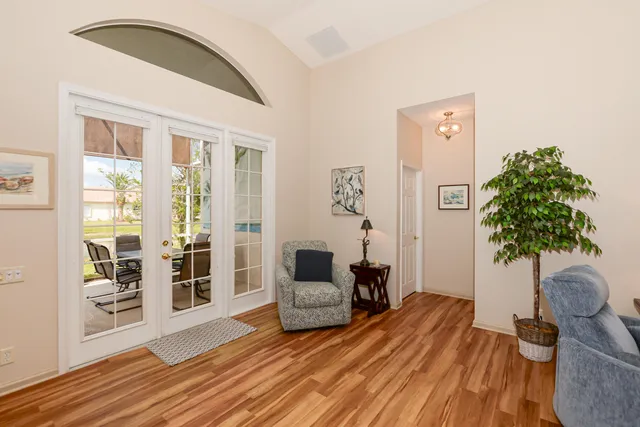 a kitchen with granite countertop white cabinets and stainless steel appliances