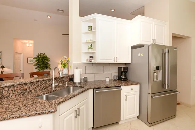 a kitchen with lots of counter space and breakfast area