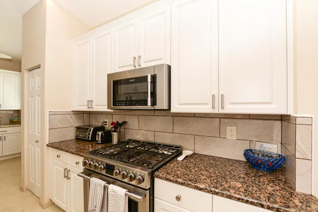 a view of a hallway with washer and dryer