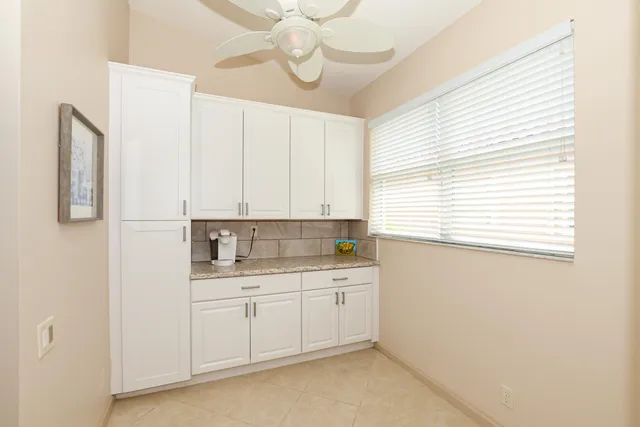 a view of a swimming pool with a yard