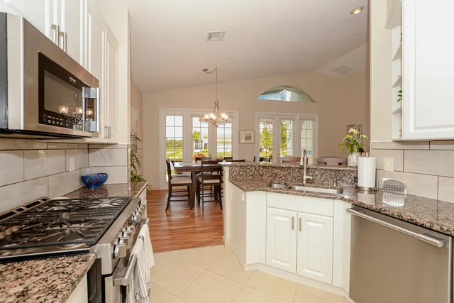 a view of a swimming pool with palm trees