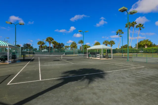 a room with pool table and windows