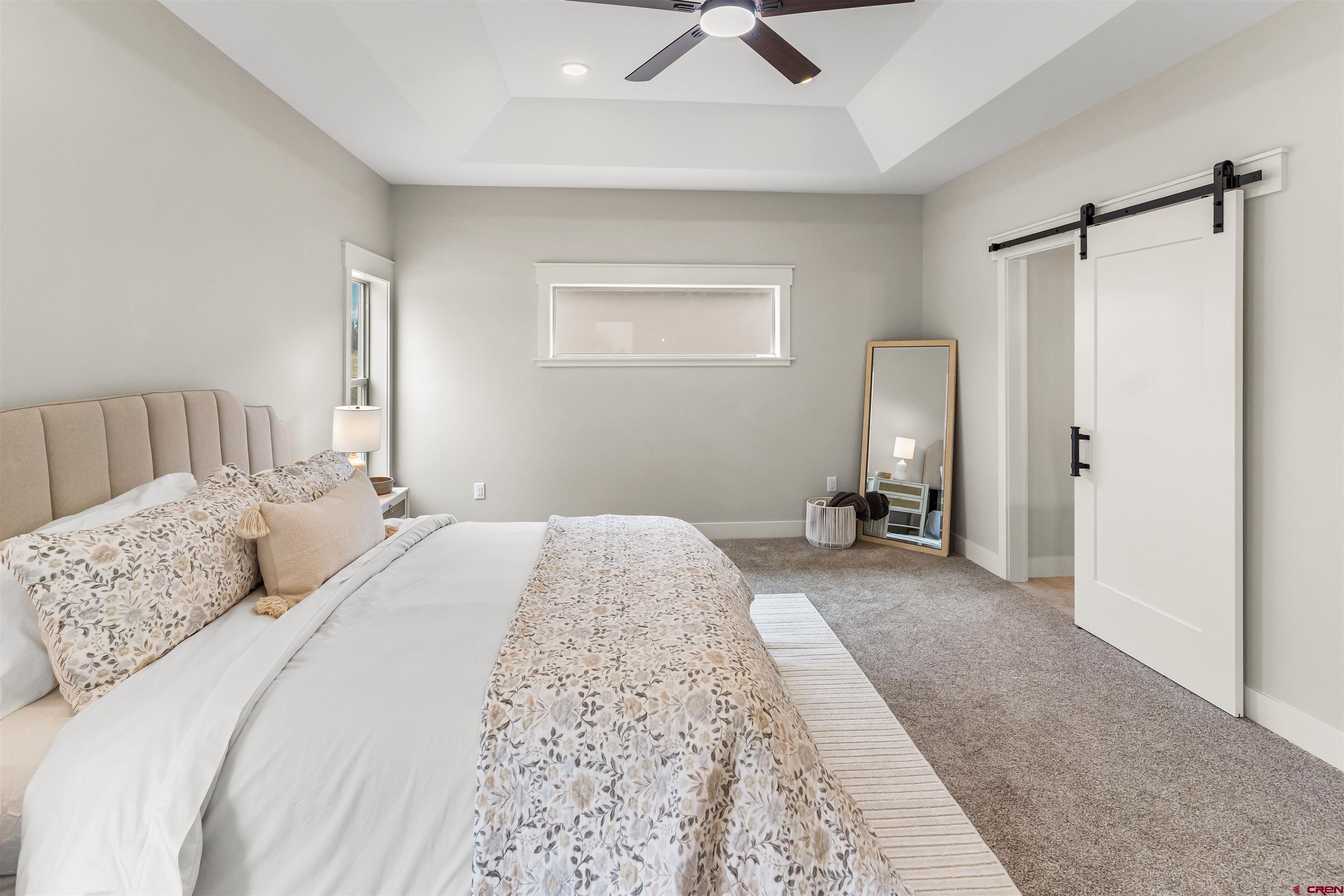 1533 Criterion Street Delta, CO 81416 - Photo 14 of 30 a bedroom with a bed and a couch