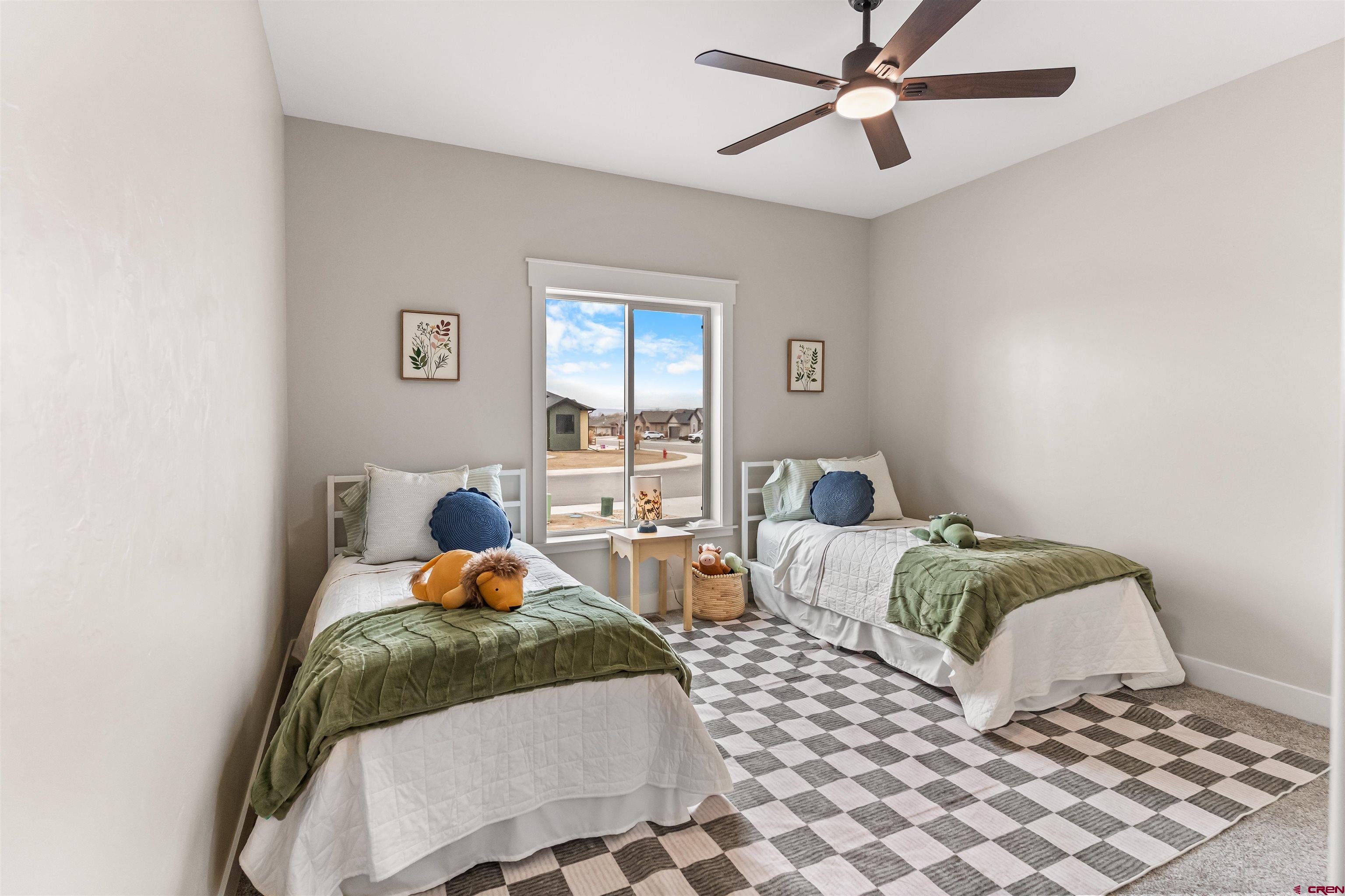 1533 Criterion Street Delta, CO 81416 - Photo 20 of 30 a bedroom with two beds and painting on the wall