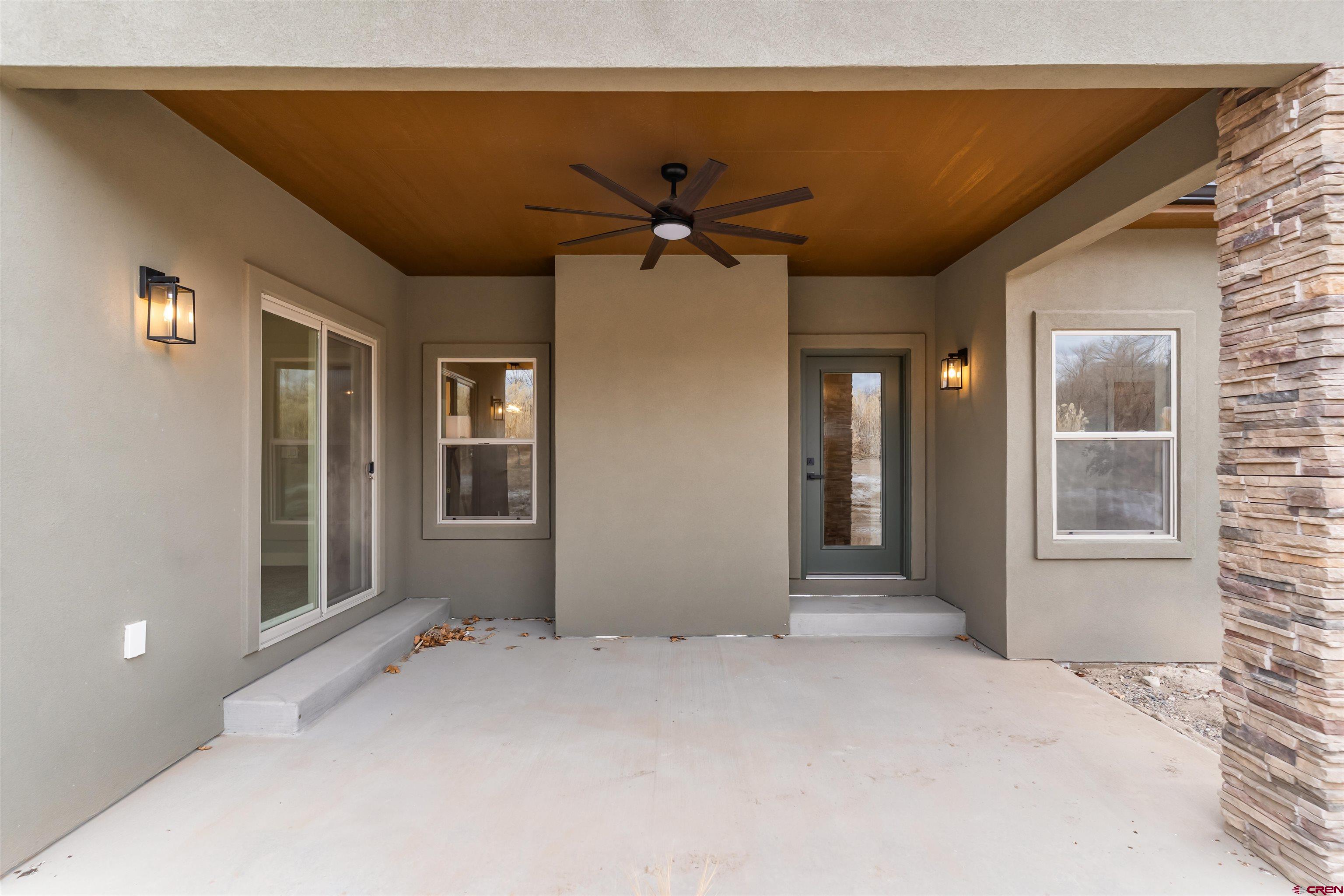 1533 Criterion Street Delta, CO 81416 - Photo 27 of 30 a view of a livingroom with a chandelier fan and windows