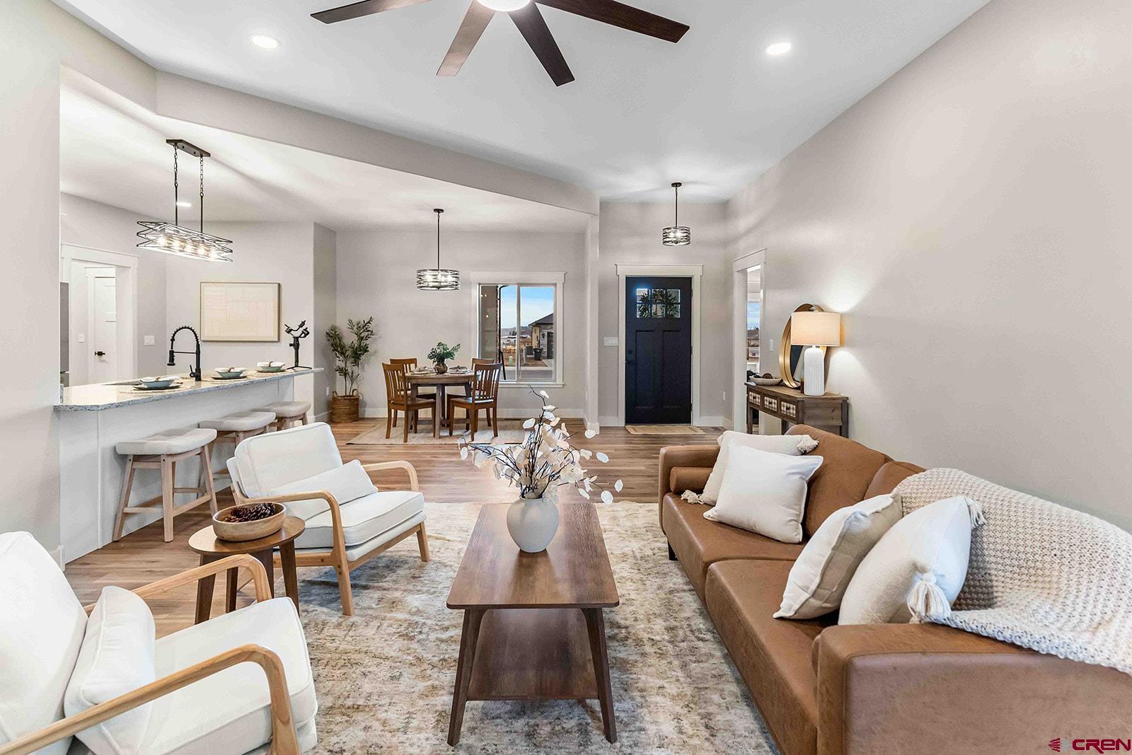 1533 Criterion Street Delta, CO 81416 - Photo 6 of 30 a living room with furniture kitchen view and a chandelier