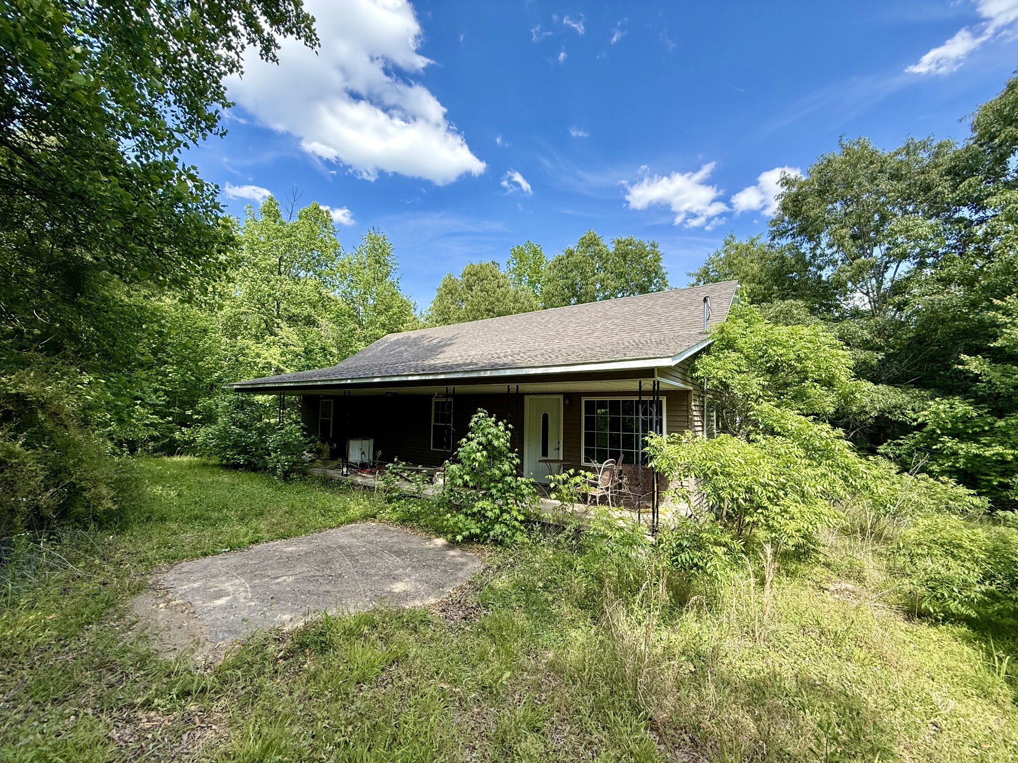 228 Henryville Road Ethridge, TN 38456 - Photo 1 of 55 a front view of a house with a yard