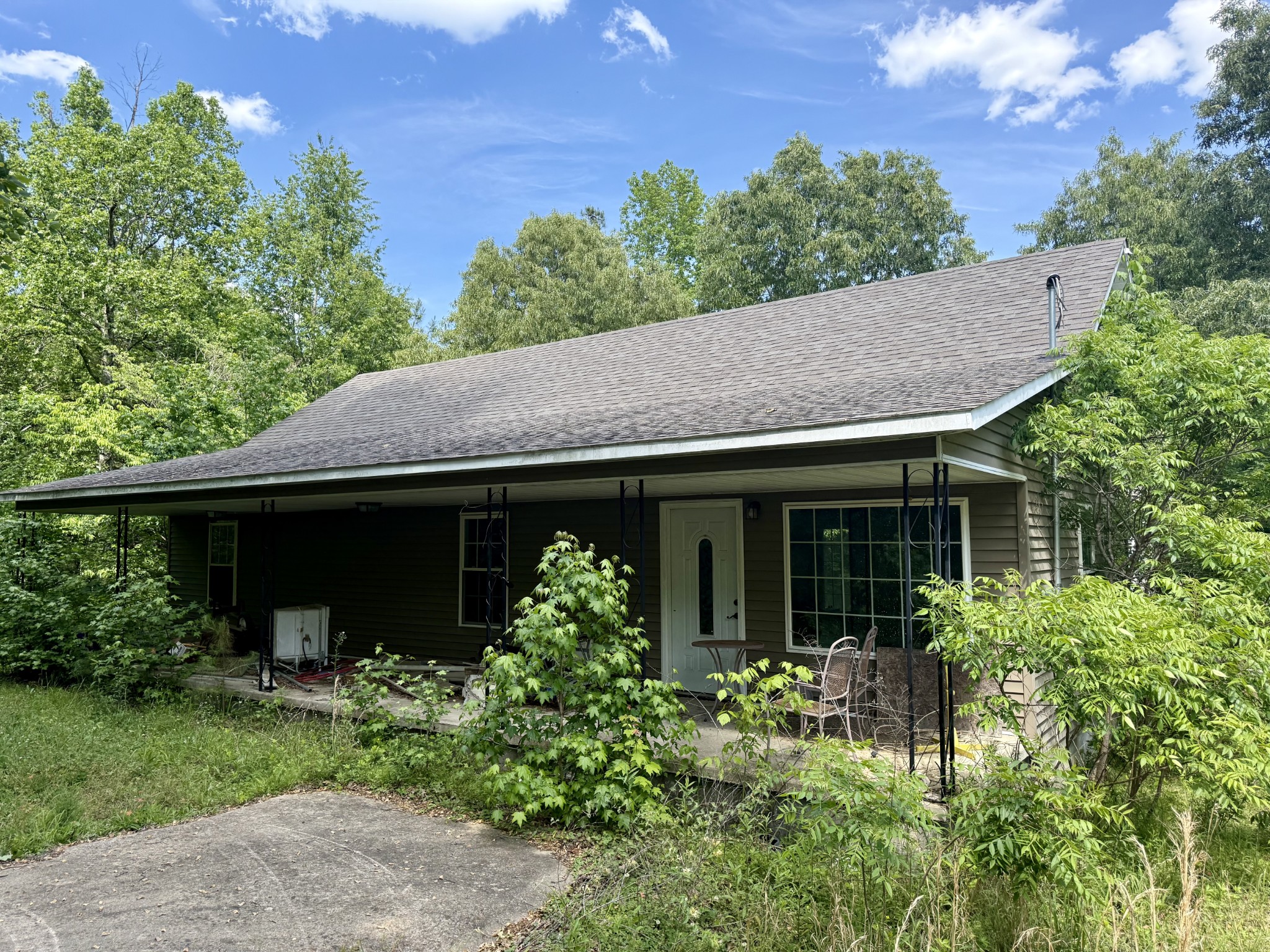 228 Henryville Road Ethridge, TN 38456 - Photo 2 of 55 a front view of a house with a garden