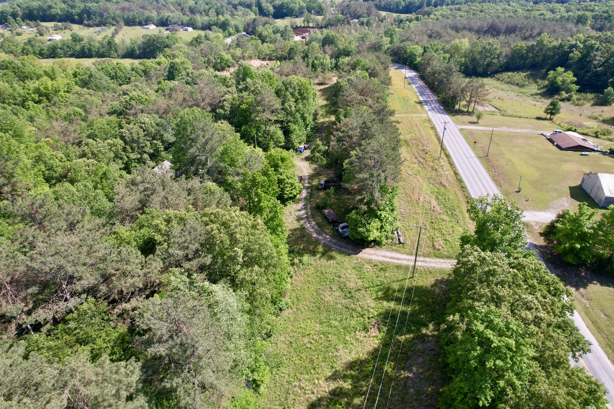 228 Henryville Road Ethridge, TN 38456 - Photo 35 of 55 an aerial view of residential houses with outdoor space and trees all around