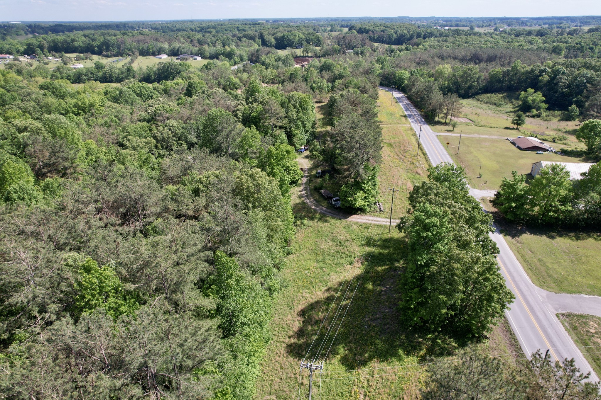 228 Henryville Road Ethridge, TN 38456 - Photo 36 of 55 a view of a city with lush green forest
